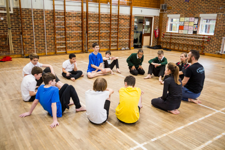 Sunnydown School pupils in a dance rehearsal with workshop leaders from Matthew Bourne's New Adventures.